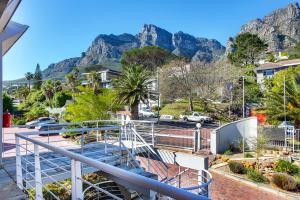 a balcony with a view of the mountains at Stunning Sea View Apartment - Camps Bay in Cape Town