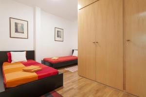Postel nebo postele na pokoji v ubytování Key Gracia Apartments