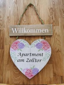 a heart shaped sign that says apartment amulla at Apartment am Zolltor in Wertheim