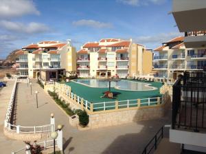 a resort with a swimming pool and some buildings at Vila Cabral 2 Apartments in Sal Rei