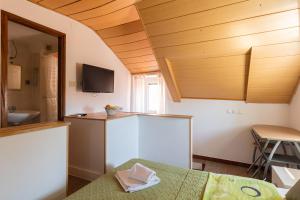 a room with a kitchen with a sink and a table at Central Old Town Apartments in Dubrovnik