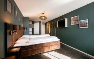 Letto o letti in una camera di Hotel Old Dutch