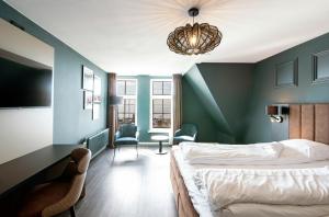 Letto o letti in una camera di Hotel Old Dutch
