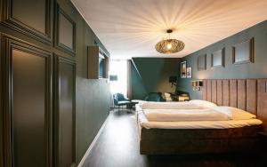 Letto o letti in una camera di Hotel Old Dutch
