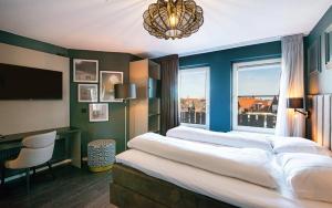 Letto o letti in una camera di Hotel Old Dutch