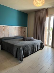 Postel nebo postele na pokoji v ubytování Tabù Hotel