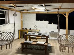 a room with a table and two chairs and a table at Queens Luxury Glamping in Palaiokastro