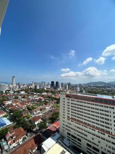 an aerial view of a city with a tall building at Mansion One by PerfectSweetHome Ocean Concept in George Town