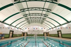 a large swimming pool with a large ceiling at Bristol self-catering studio+kitchen+parking in Bristol