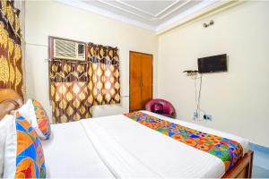 Postel nebo postele na pokoji v ubytování FabHotel Heritage Inn