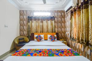 Postel nebo postele na pokoji v ubytování FabHotel Heritage Inn