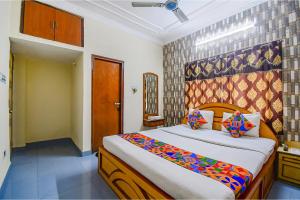 Postel nebo postele na pokoji v ubytování FabHotel Heritage Inn