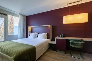 Postel nebo postele na pokoji v ubytování Amrâth Airport Hotel Rotterdam