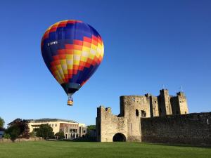 a hot air balloon flying over a castle at Trim Castle Hotel in Trim