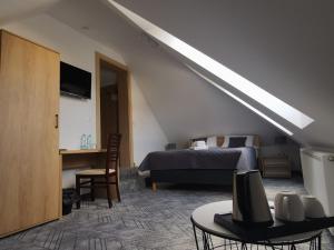 Ein Bett oder Betten in einem Zimmer der Unterkunft Kalinowy Sen II