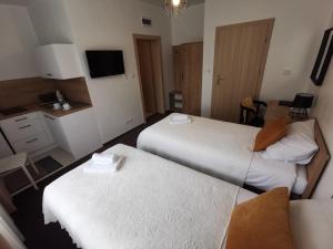 Ein Bett oder Betten in einem Zimmer der Unterkunft Kalinowy Sen II