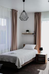 Ein Bett oder Betten in einem Zimmer der Unterkunft Kalinowy Sen II