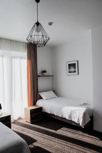 Ein Bett oder Betten in einem Zimmer der Unterkunft Kalinowy Sen II