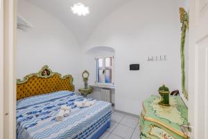 a bedroom with a bed with teddy bears on it at San Francesco in Finale Ligure