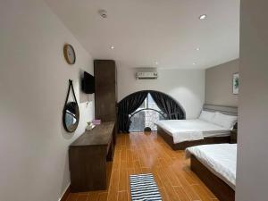 Postel nebo postele na pokoji v ubytování HAPPY HOTEL Tp Rạch Giá, Kiên Giang