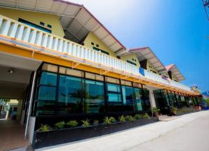 a building with large windows on the side of it at Harmony Bed & Bakery in Ko Lipe