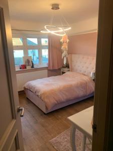 a bedroom with a bed and a window at Welcoming Childwall Towers in Childwall