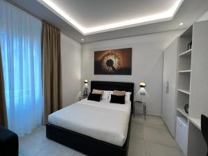 a bedroom with a bed and a large window at EVA affittacamere in La Spezia +25 photos
