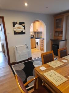 a kitchen and dining room with a table and chairs at Quiet 3 bed close to the A1 in Newton Aycliffe