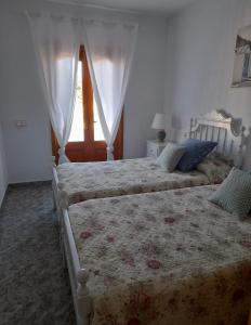 Een bed of bedden in een kamer bij Casa rural Las Marismas
