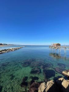 a view of a body of water with a pier at Dimora Mucci in Termoli