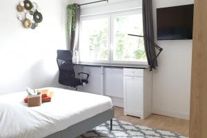 Telewizja i/lub zestaw kina domowego w obiekcie Le Cosy 120m² - 4 chambres - 8 personnes