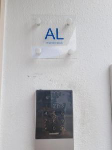 an al sign on the wall of a room at Alojamento Local Vitoria in Batalha