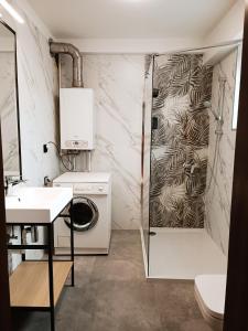 a bathroom with a shower and a washing machine at Pokoje gościnne Jola in Drawsko Pomorskie +100 photos