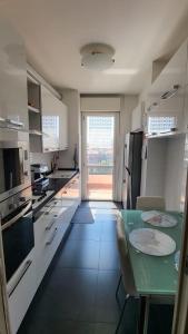 Kuchyň nebo kuchyňský kout v ubytování B&B - Camera doppia con bagno privato in stupendo attico con vista mozzafiato