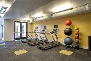 a row of treadmills in a fitness room at San Mateo 1br w pool gym wd nr Caltrain SFO-1237 in San Mateo