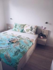 a bedroom with a bed with plants on it at BRAND NEW lovely apartment Bella in Dubrovnik
