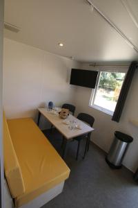 Postelja oz. postelje v sobi nastanitve Loggia Camping Belle-Vue 2000