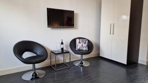 TV a/nebo společenská místnost v ubytování B&B De Droomhoeve
