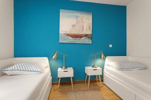 Voodi või voodid majutusasutuse Apartments Cesare with Shared Pool toas