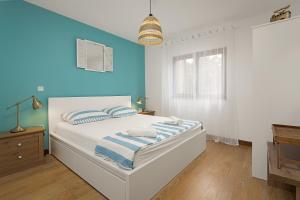 Voodi või voodid majutusasutuse Apartments Cesare with Shared Pool toas