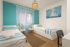 Voodi või voodid majutusasutuse Apartments Cesare with Shared Pool toas +37 fotot
