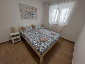 Postel nebo postele na pokoji v ubytování Seashells Apartments Tribunj