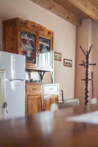 Kuchyň nebo kuchyňský kout v ubytování Fenil Conter Cottage & Suite