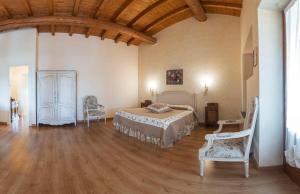 Postel nebo postele na pokoji v ubytování Fenil Conter Cottage & Suite
