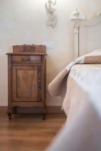 Postel nebo postele na pokoji v ubytování Fenil Conter Cottage & Suite