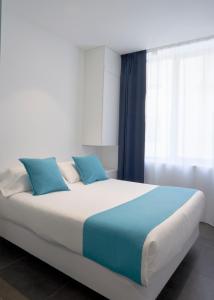 Uma cama ou camas num quarto em Hotel 54 Barceloneta