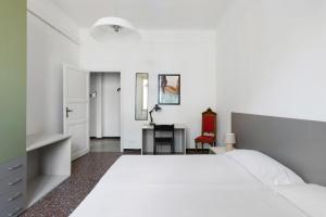 เตียงในห้องที่ Irnerio Apartments by Wonderful Italy