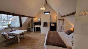 Postel nebo postele na pokoji v ubytování B&B De Droomhoeve