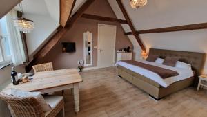 Postel nebo postele na pokoji v ubytování B&B De Droomhoeve
