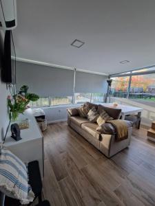 a living room with a couch and a table at Casa dos Avós - Folgosa Douro in Folgosa